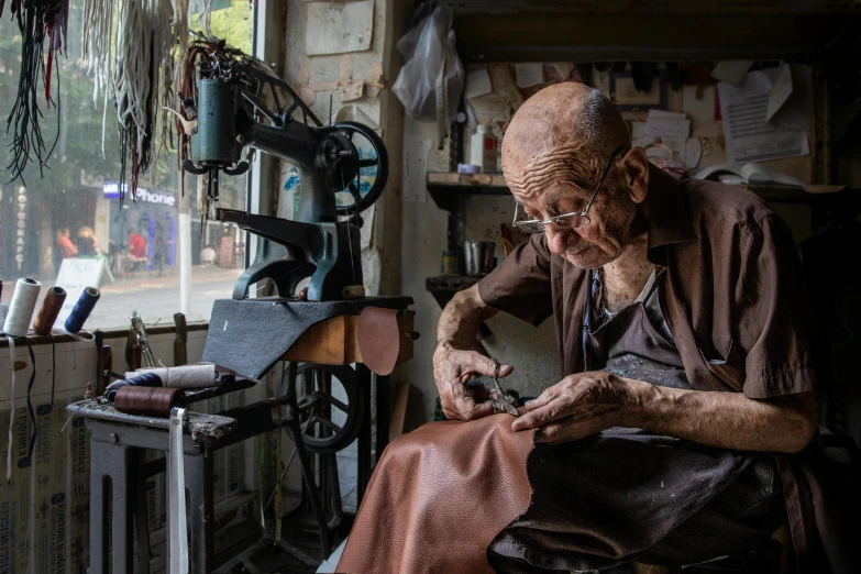 the woman is working on the sewing machine