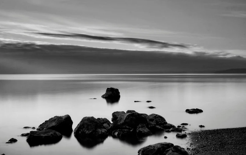 a long exposure of rocks at the shoreline