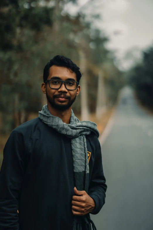 a man stands on the side of a road