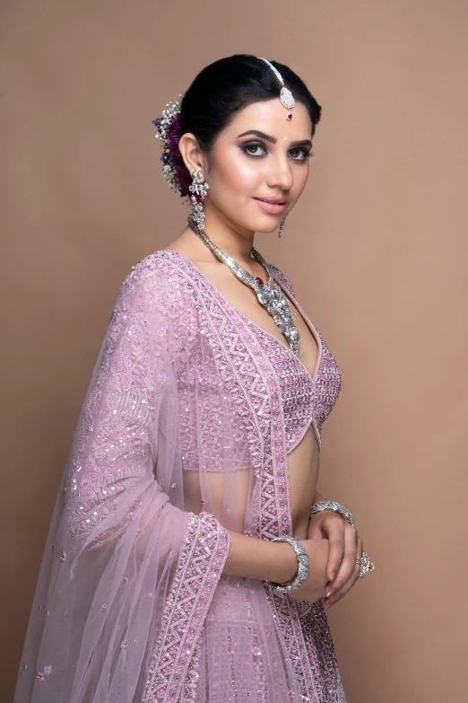 a beautiful woman in a long gown with jewelry