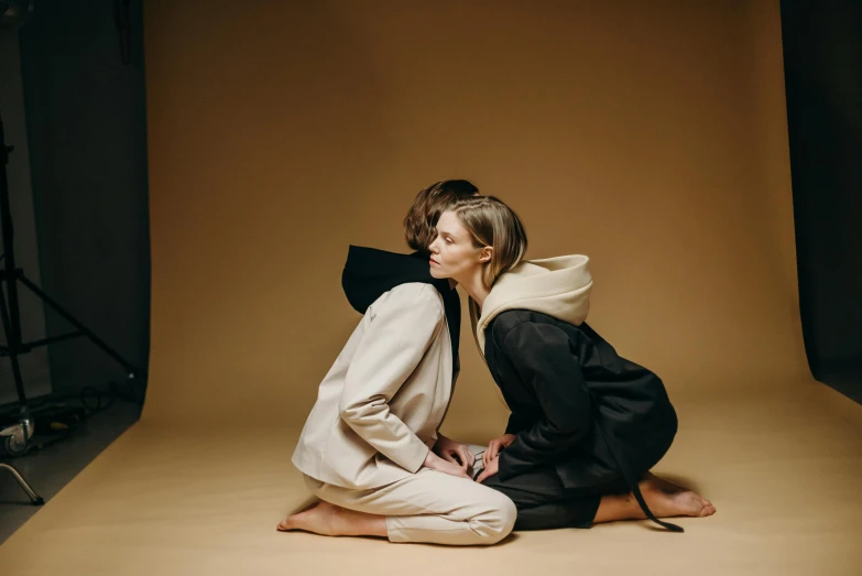 a woman kneeling down in a po studio