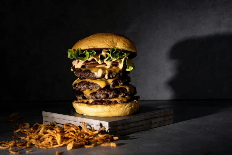 a burger, and some fries on a table