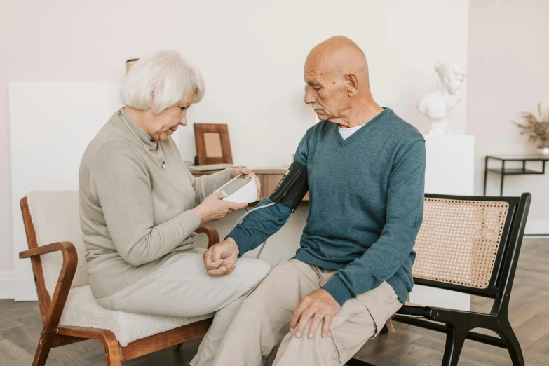 an older gentleman listening to his female companion