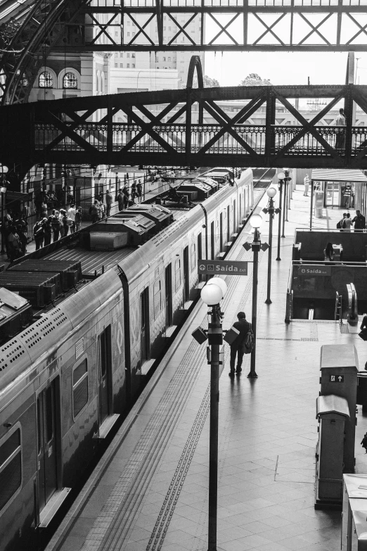 some people standing near an outdoor train station