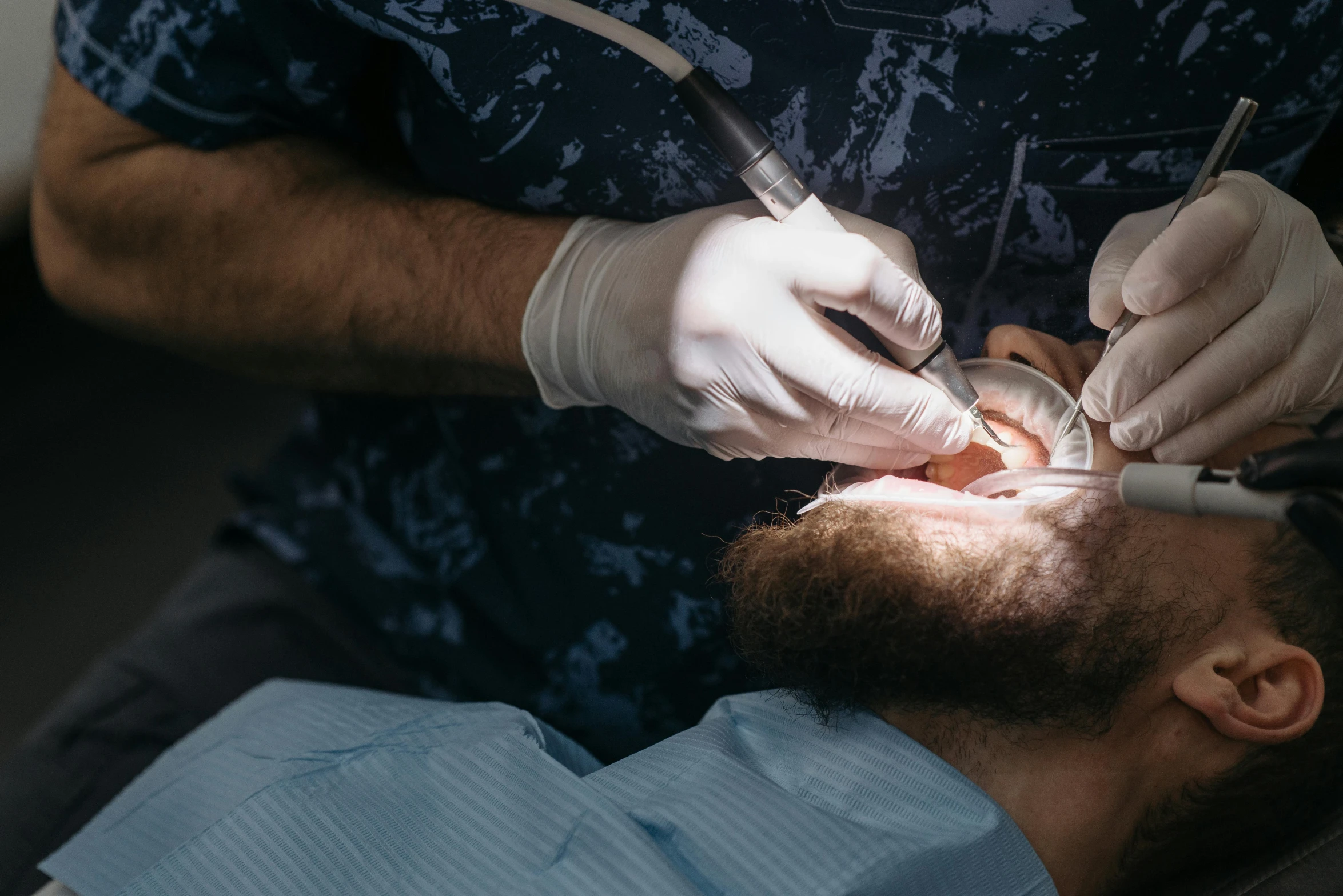 a dentist performing dental work on a patient