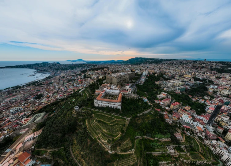 an aerial view of a small town on the top of a mountain