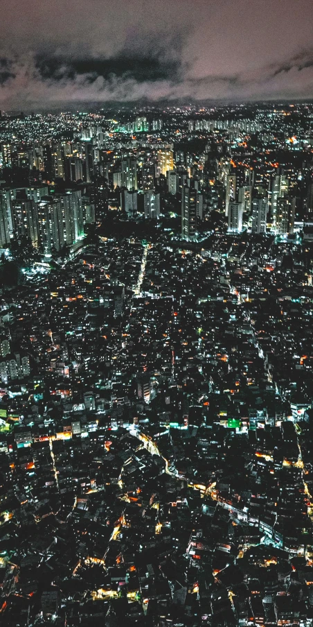 an aerial view of the city lights at night