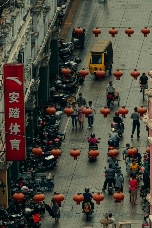 an overhead s of a street decorated in chinese lanterns