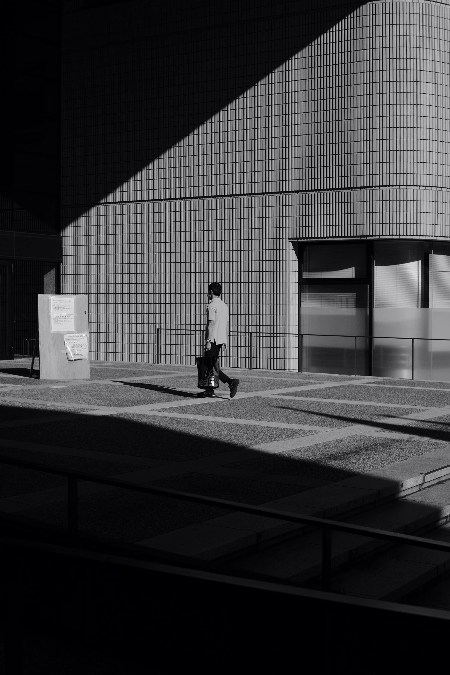 person standing in front of a building on the ground