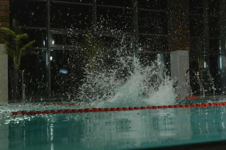 an image of the water splash coming off the side of the pool