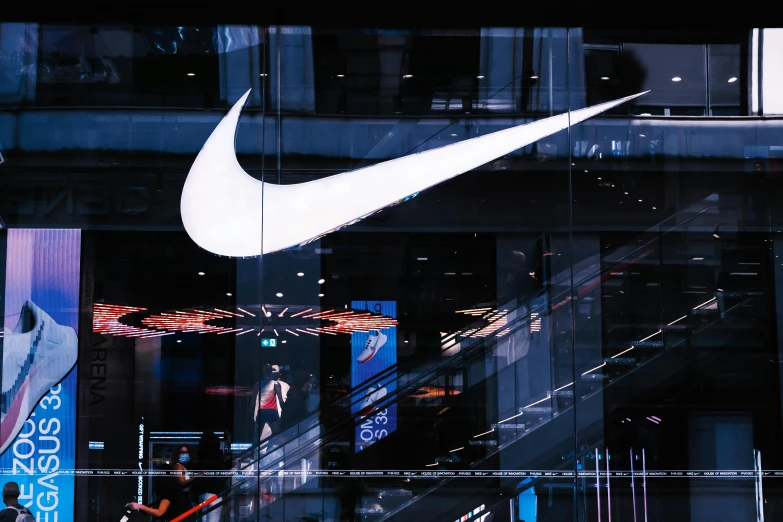 the logo of nike is shown in front of a display window