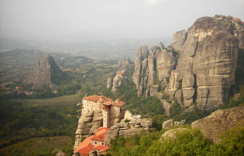 a stone structure at the top of a mountain