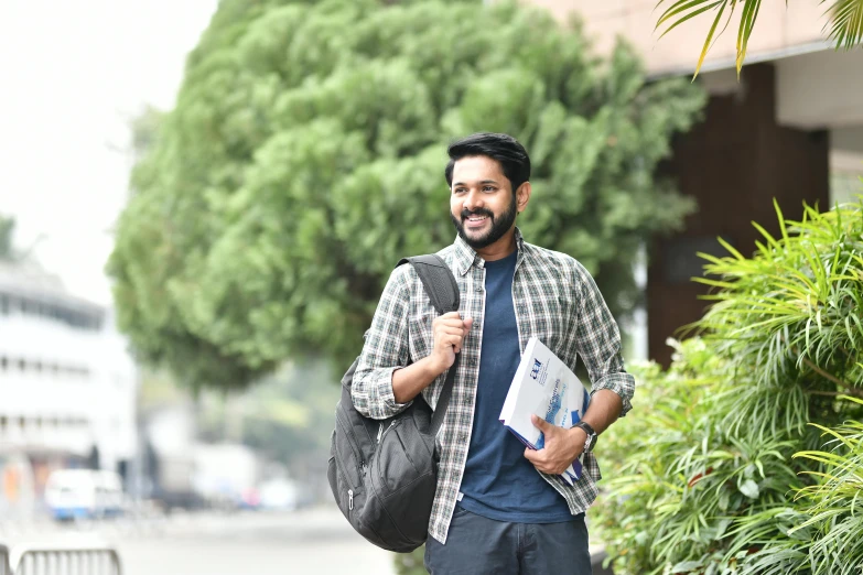 an image of a man with backpack going for a hike