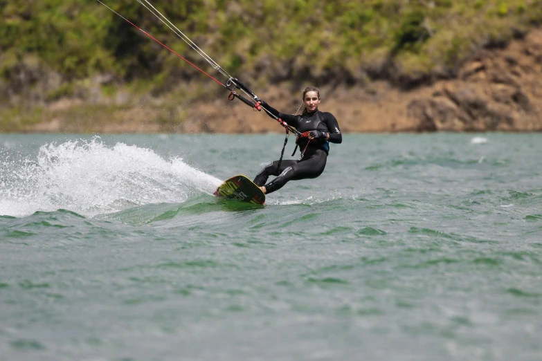 a person riding on top of a surf board on a body of water