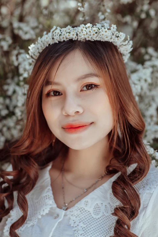 an asian woman with long hair wearing a head band