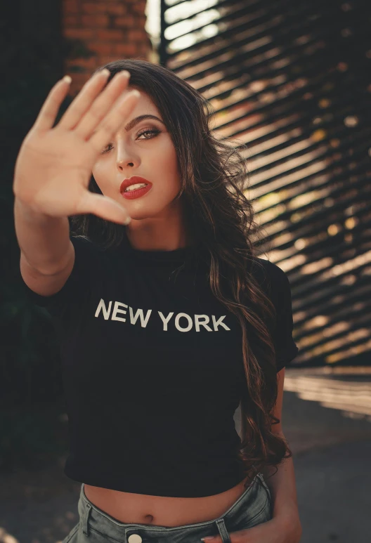 woman wearing new york shirt waving