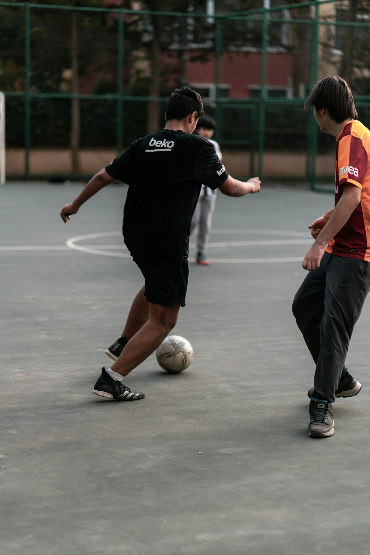 there are two men that are playing soccer together