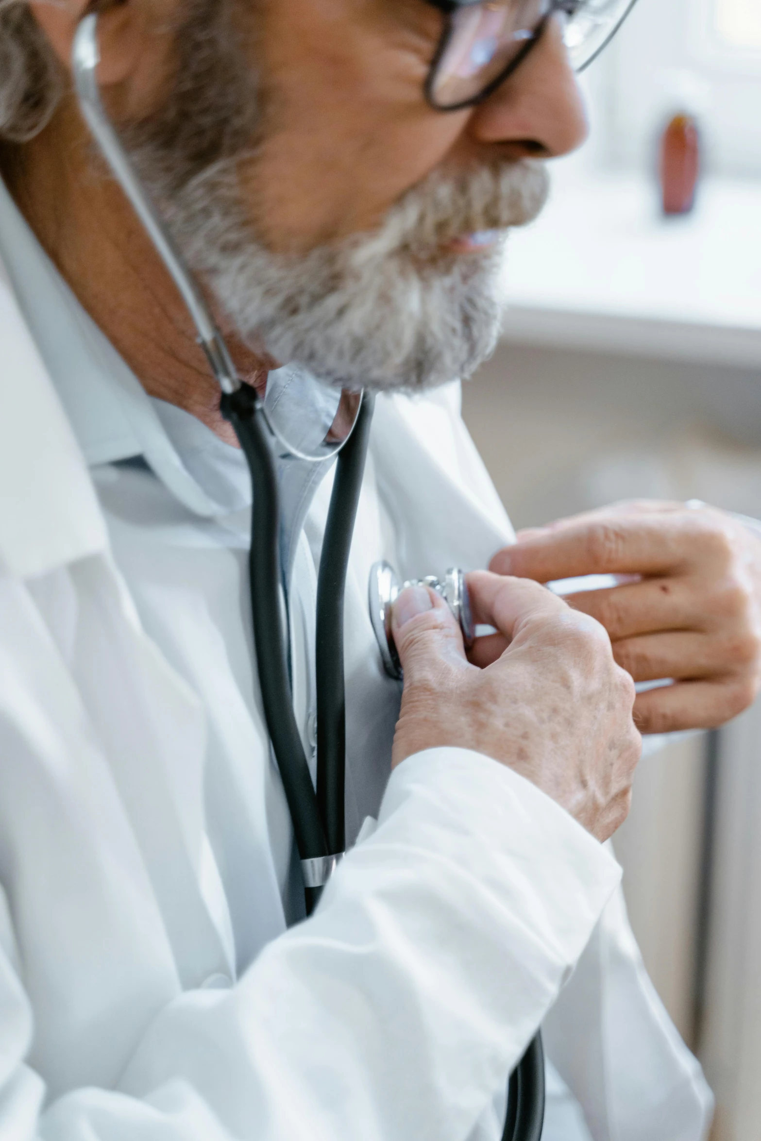 a doctor putting a stethoscope on a man's arm