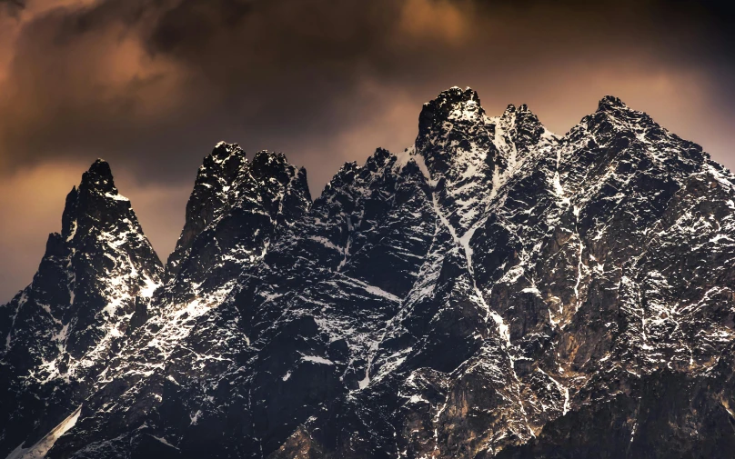 the snow covered mountains of patzland are illuminated by low lights