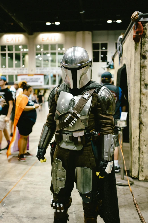 the man in the star wars cosplay is posed in costume