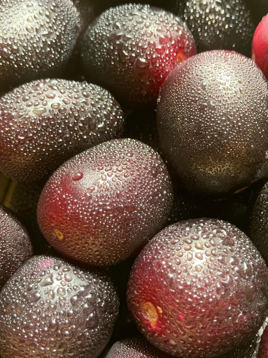 a group of tropical fruit that are red