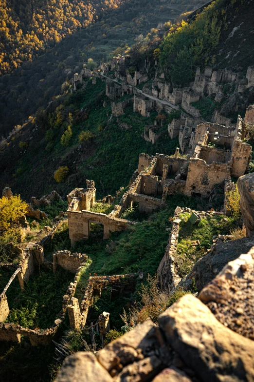 a view from the top of a hill with buildings in the foreground