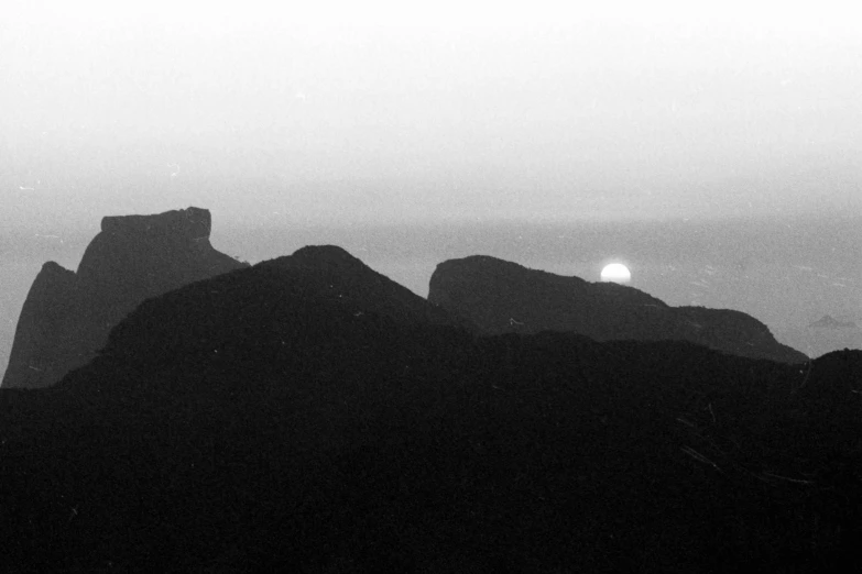 a black and white image of two large rocks