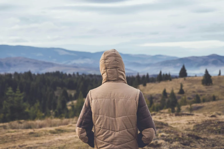 a person standing on the side of a mountain