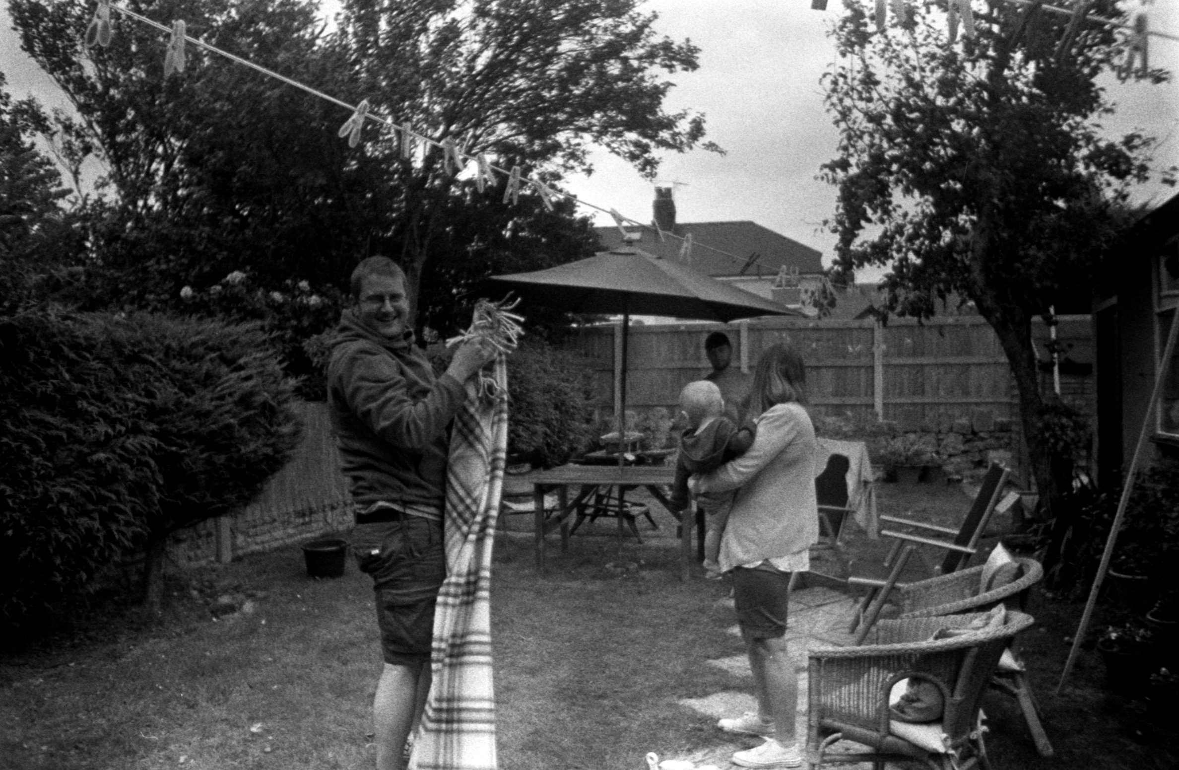 a man holding an umbrella and some people