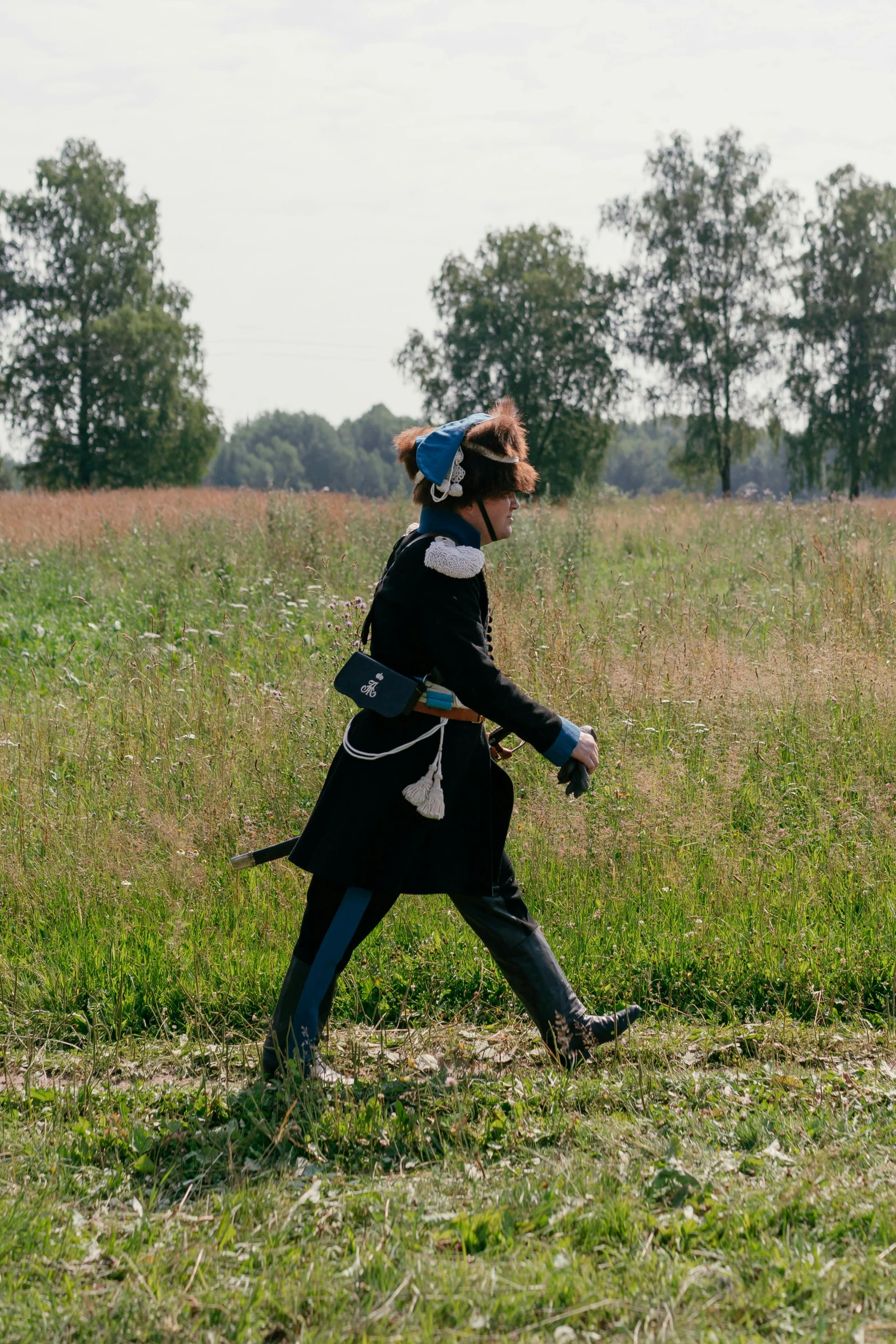 a person riding a horse while holding onto a harness