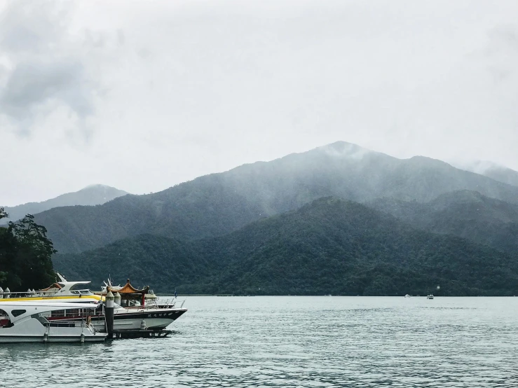 a boat floating in the middle of a lake