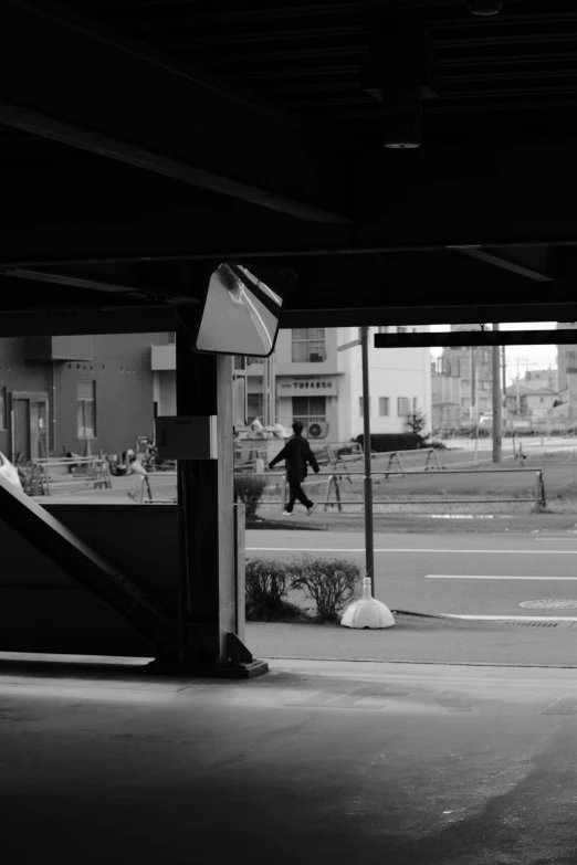 a man that is standing up against a rail