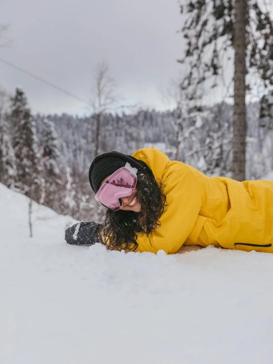 there is a person laying in the snow