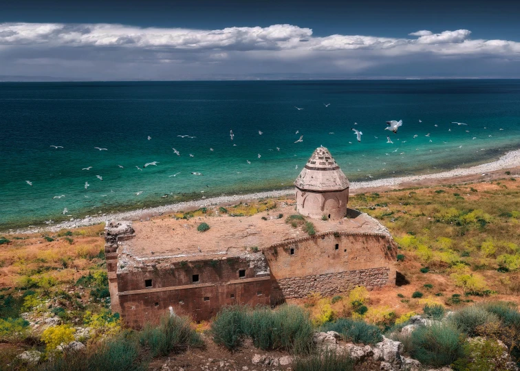 an old ruin on the shore line overlooking the ocean