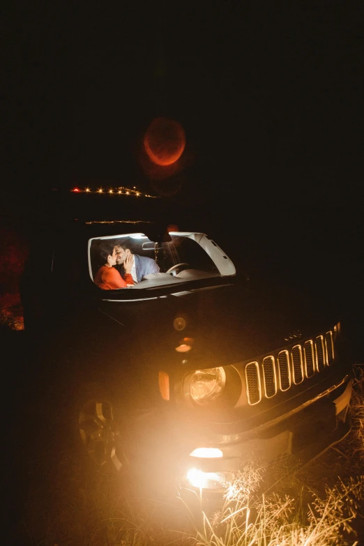 a man and his dog are in the bed of a truck