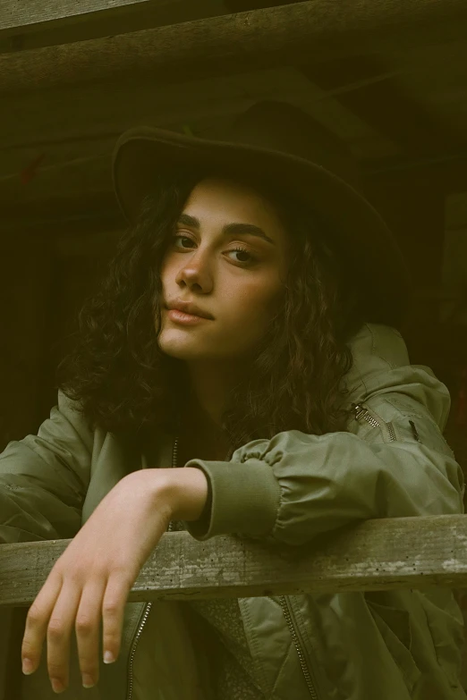 a young lady with long hair wearing a hat