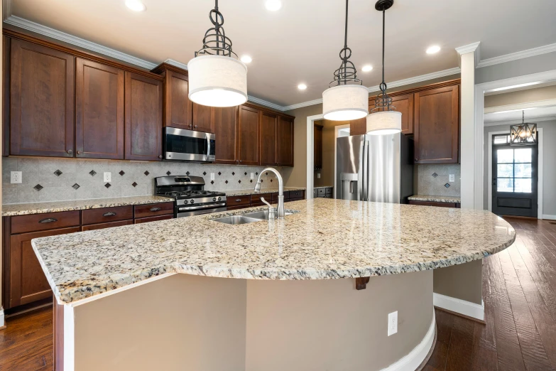 a kitchen filled with lots of counter tops next to a refrigerator