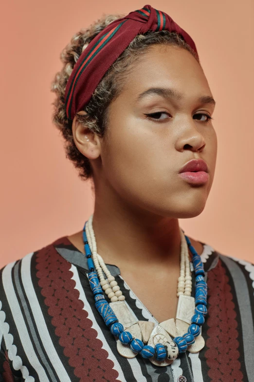 woman with colorful clothes, wearing a beaded head band