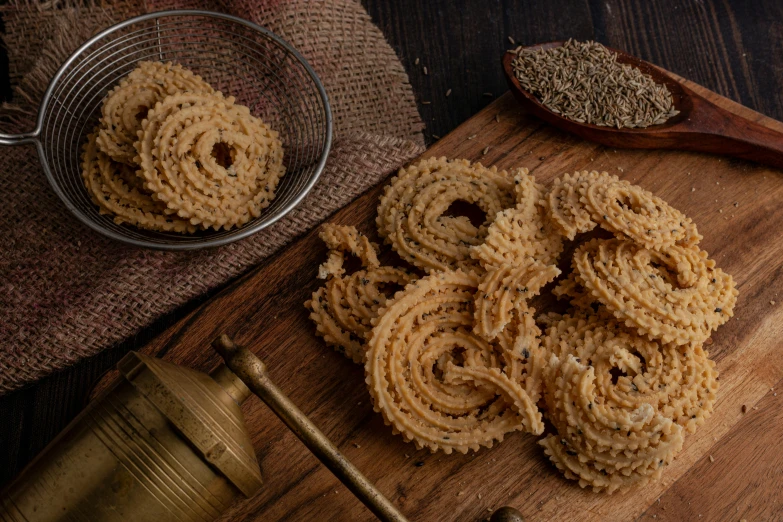 rice curls sitting on top of a wooden table