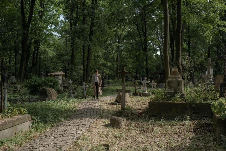 an old cemetery with two men walking