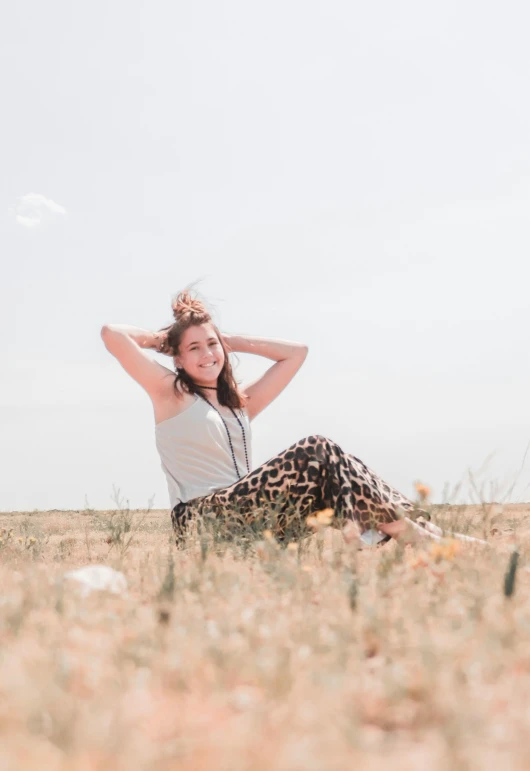 a girl in white shirt and animal print pants