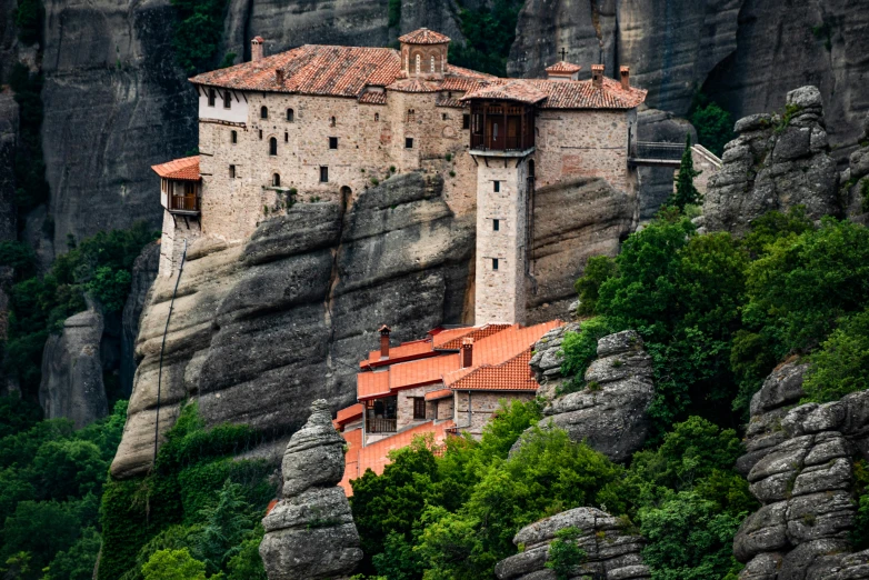 a mountain with a house built into it