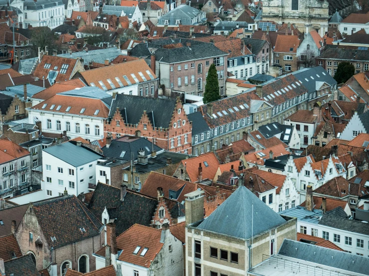 an aerial view of red roofs and white buildings