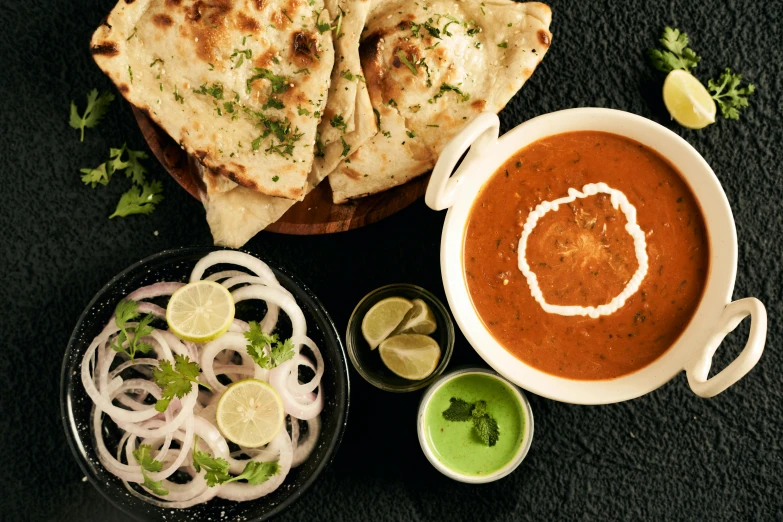 a table filled with dishes and garnished with various kinds of food