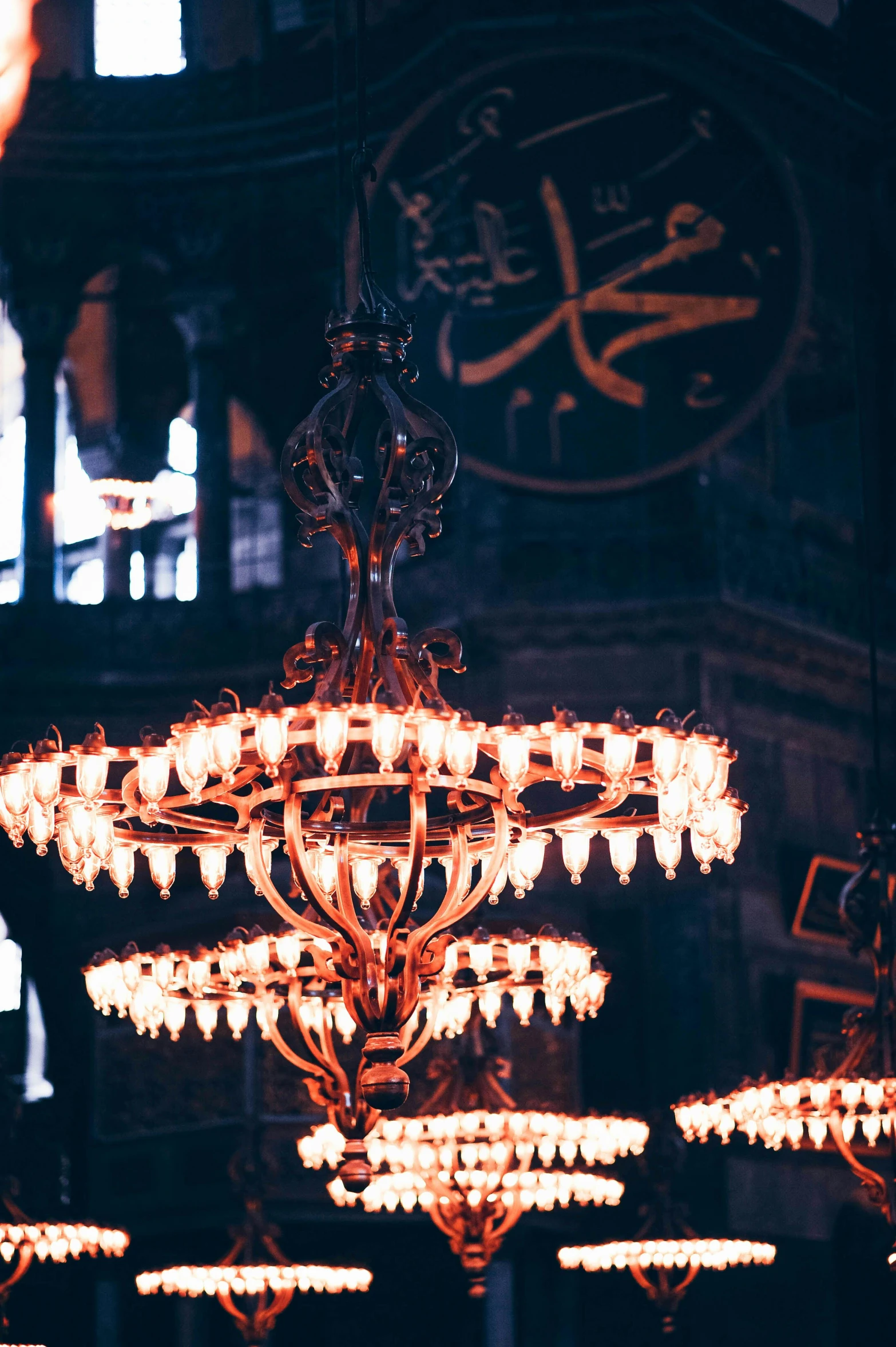 the large chandelier in the large room has many lights in it