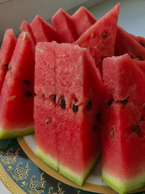 slices of watermelon are shown on a plate
