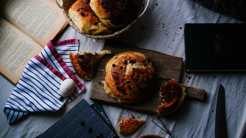 a potted food with a knife on top of a wooden board