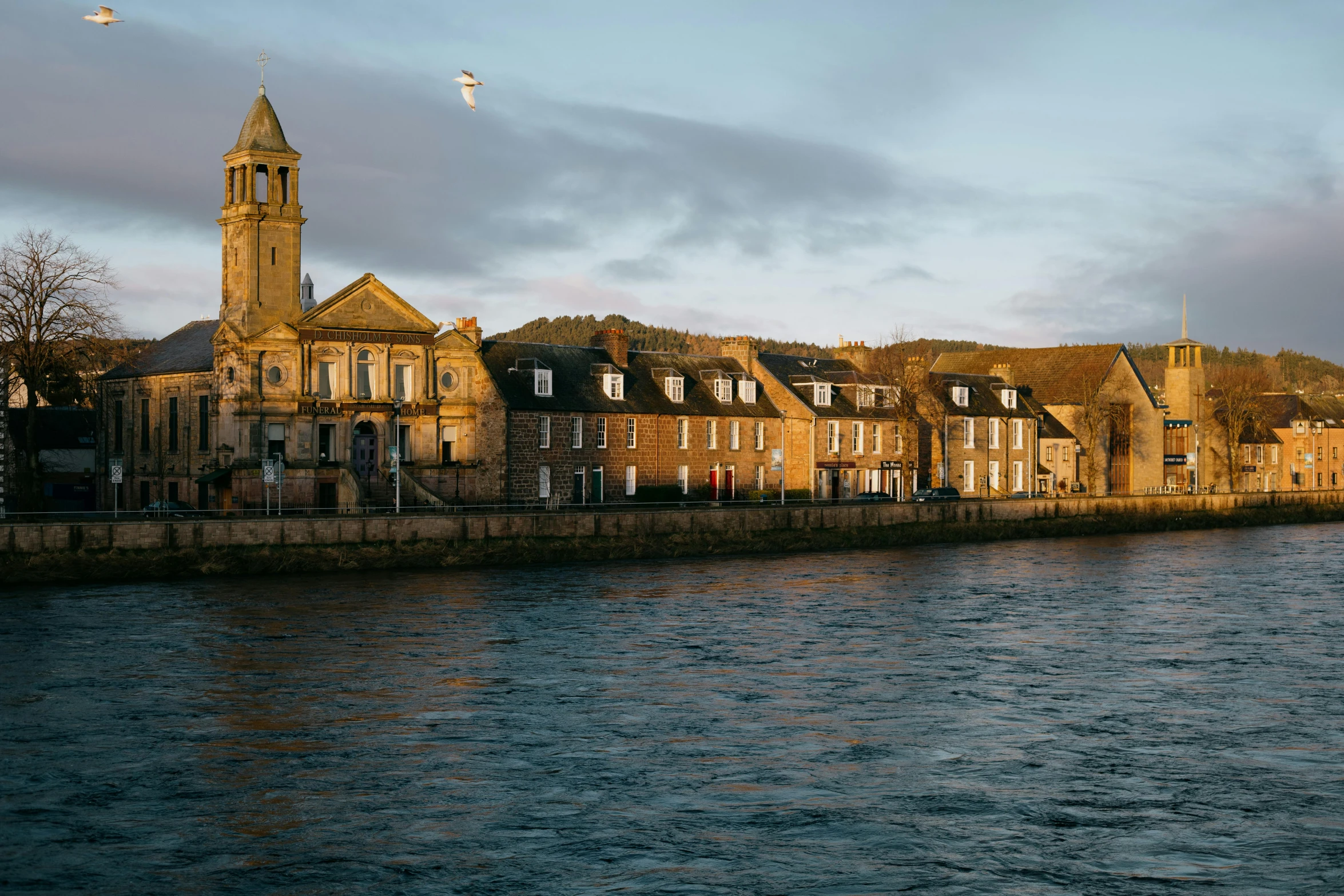 there are some buildings by a body of water