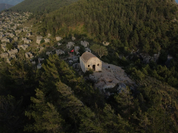 the tower on top of the hill has a small hut with two doors in it