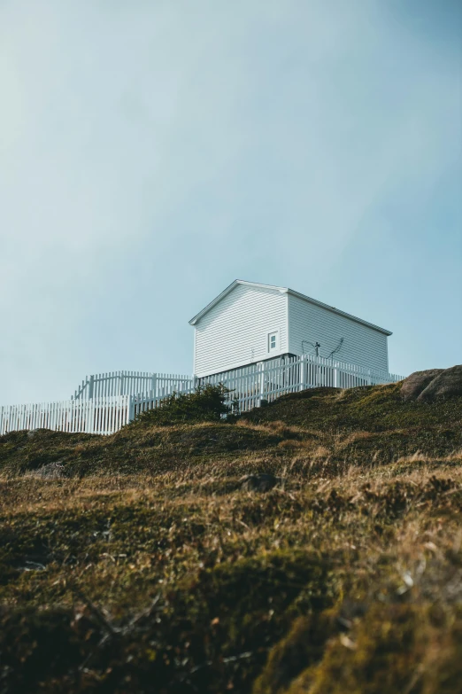 a building is shown on the side of a hill